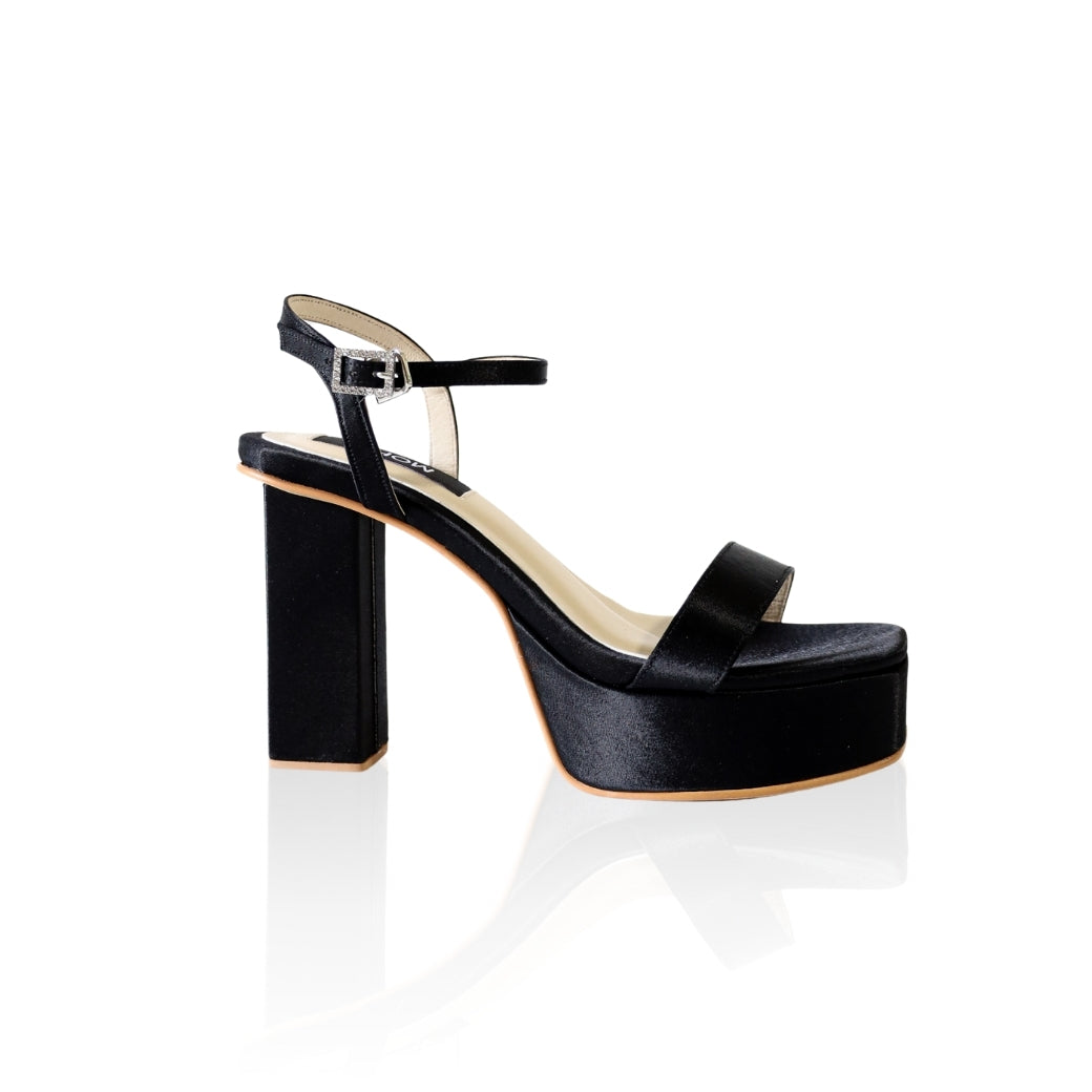 The Barbie platform heels with a diamond-embellished buckle and 4-inch heel, in black