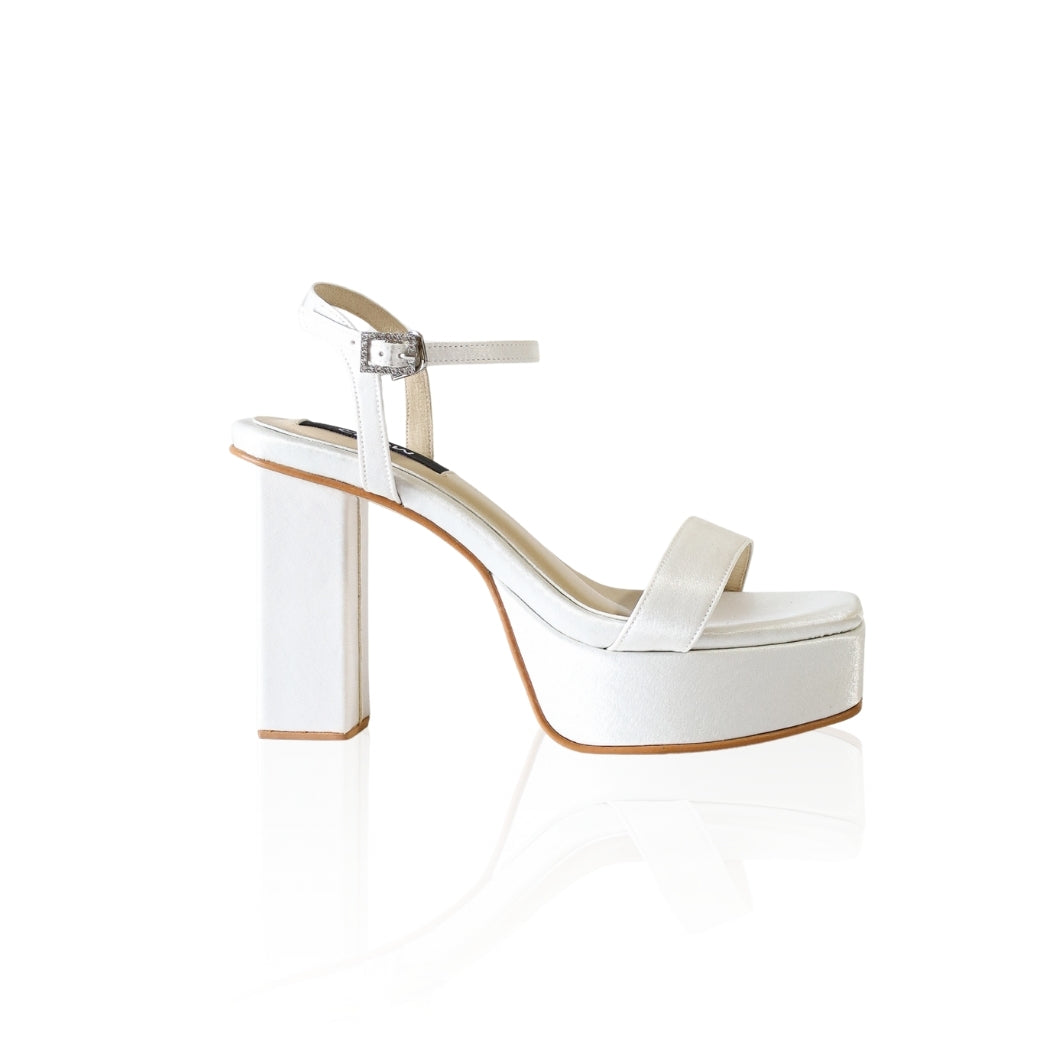The Barbie platform heels with a diamond-embellished buckle and 4-inch heel, in white