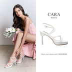 Model wearing The Cara crystal heels in white