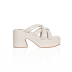 The Miguel cross-strap platform sandals with a 3.5-inch block heel, in ivory