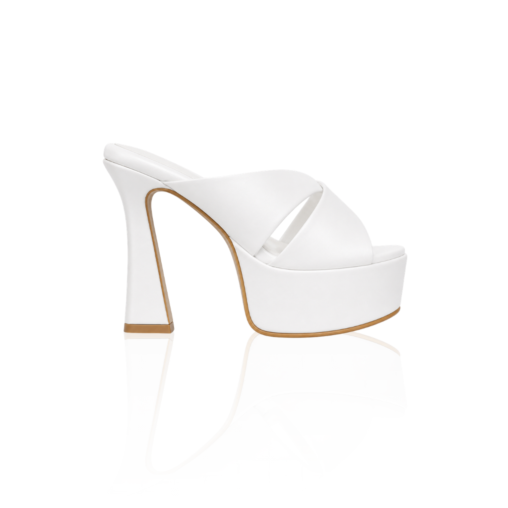 The Sophia cross-strap platform mules with a 5.7-inch heel, in white