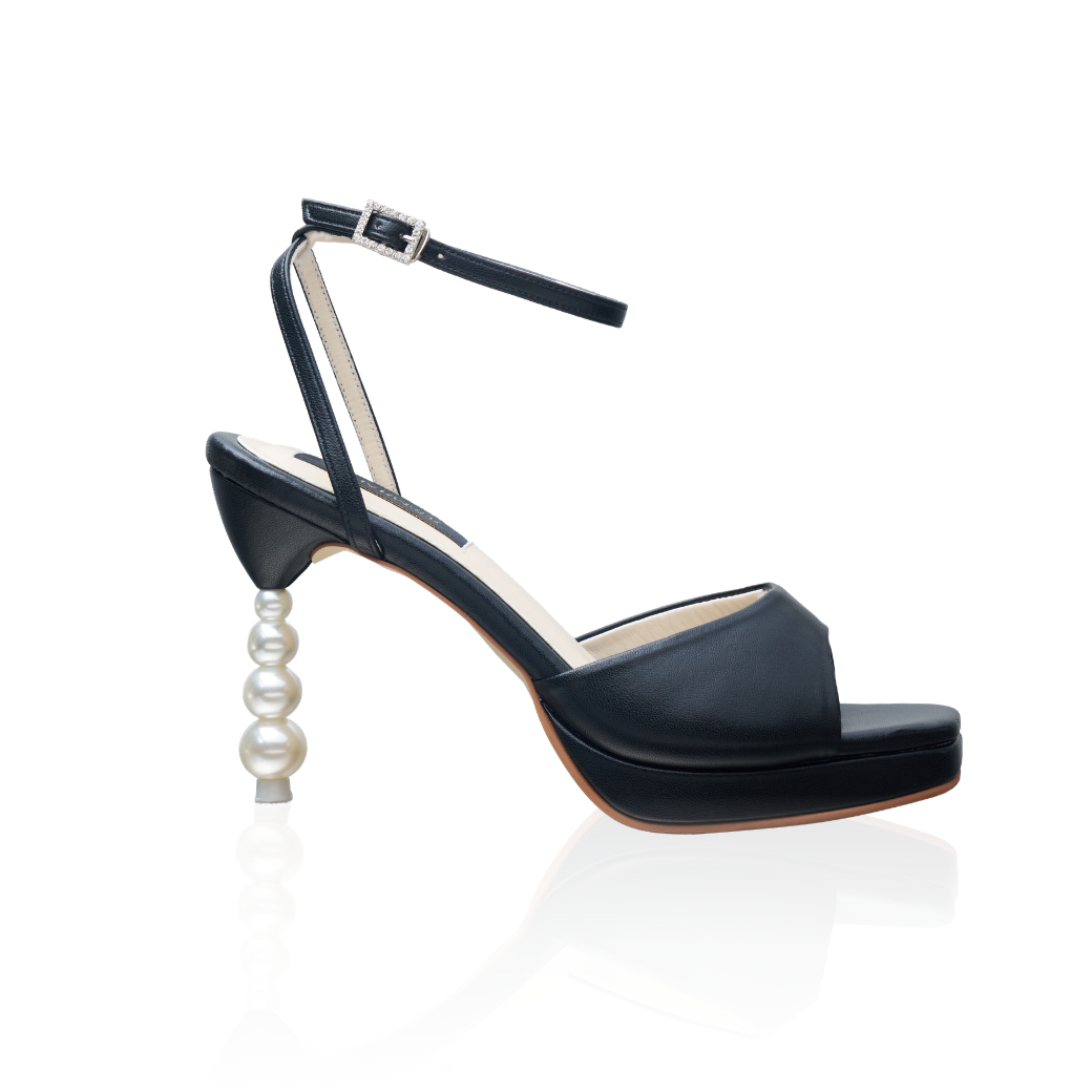 The Vida pearl-heel platform sandals with a 4-inch heel and ankle strap, in black